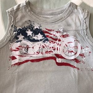 Boy tank top with America flag.